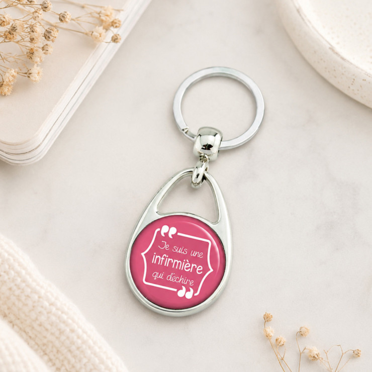                     Porte clés "Je suis une infirmière qui déchire" rose
                  