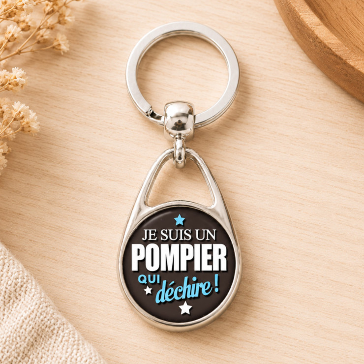                     Porte clé Pompier qui déchire - Bleu
                  