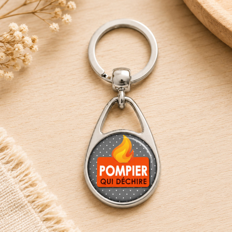       Porte clés "Pompier qui déchire" gris
    