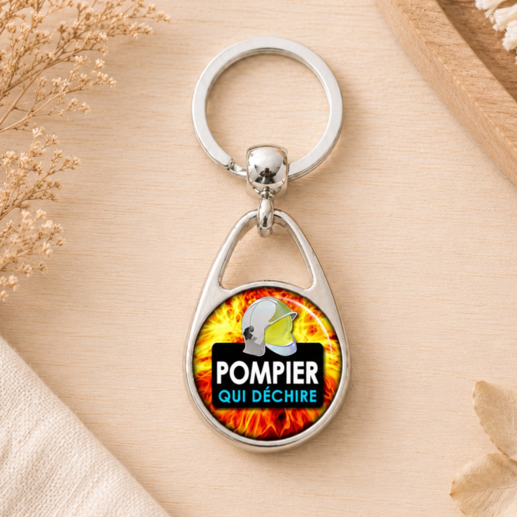                     Porte clés Pompier qui déchire - Métal
                  