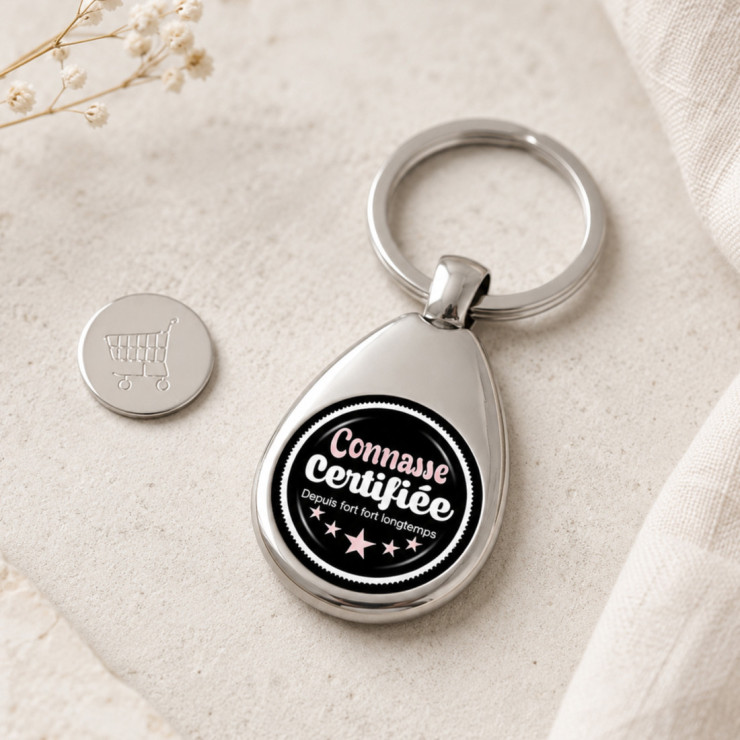                     Porte clés jeton de caddie Connasse
                  