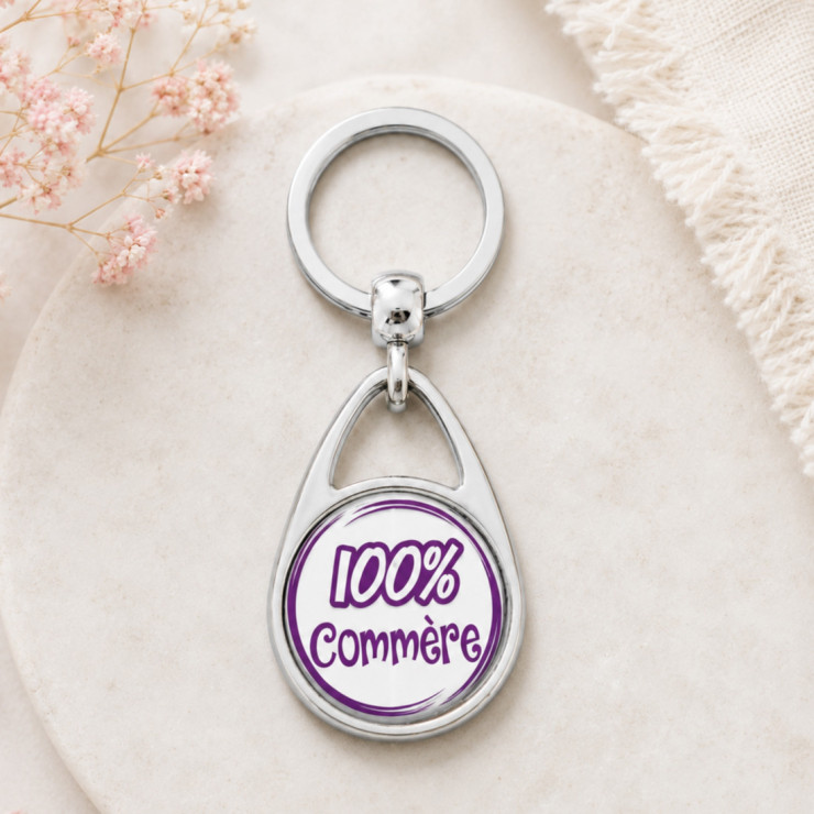                     Porte clés "100% Commère"
                  