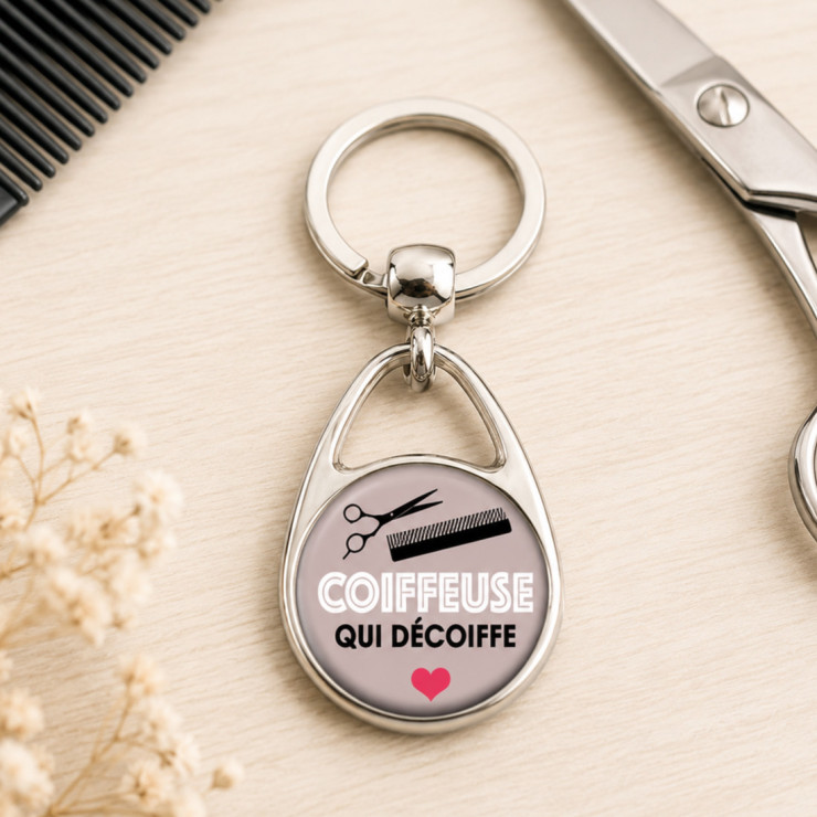       Porte clés "Coiffeuse qui décoiffe" gris
    