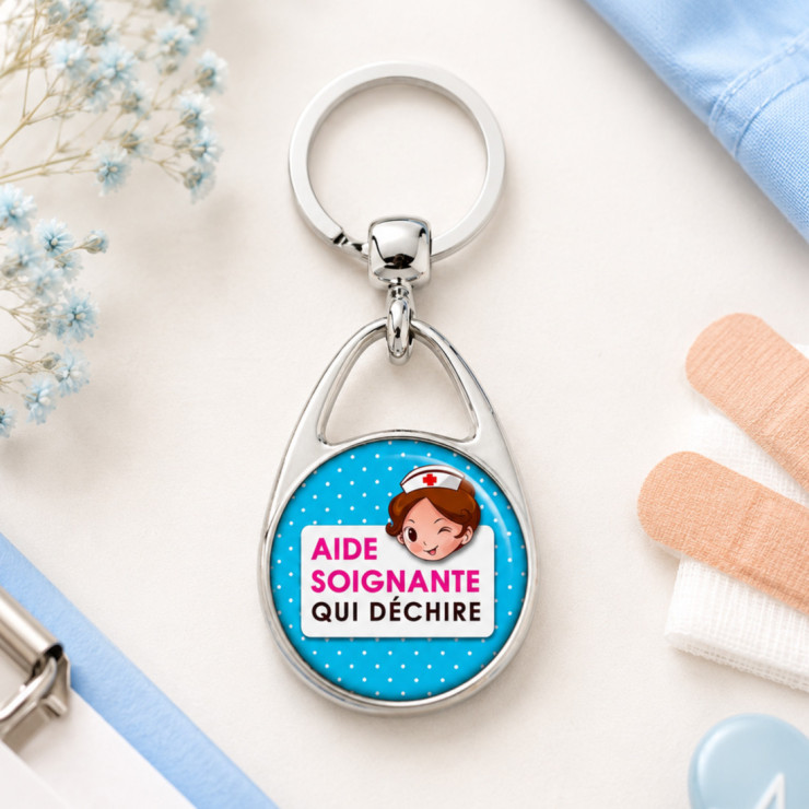                     Porte-clés "Aide soignante qui déchire" bleu
                  