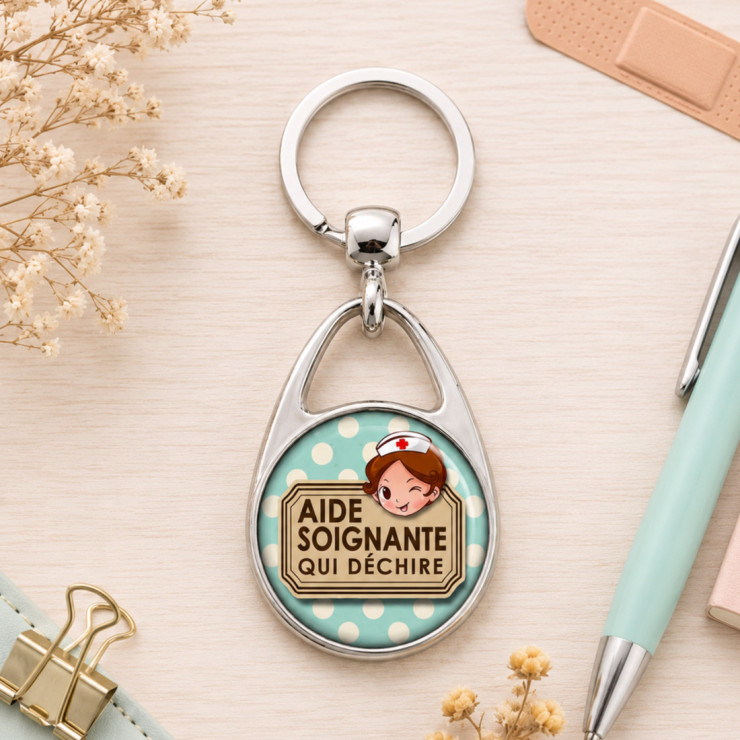       Porte clés "Aide soignante qui déchire" bleu
    