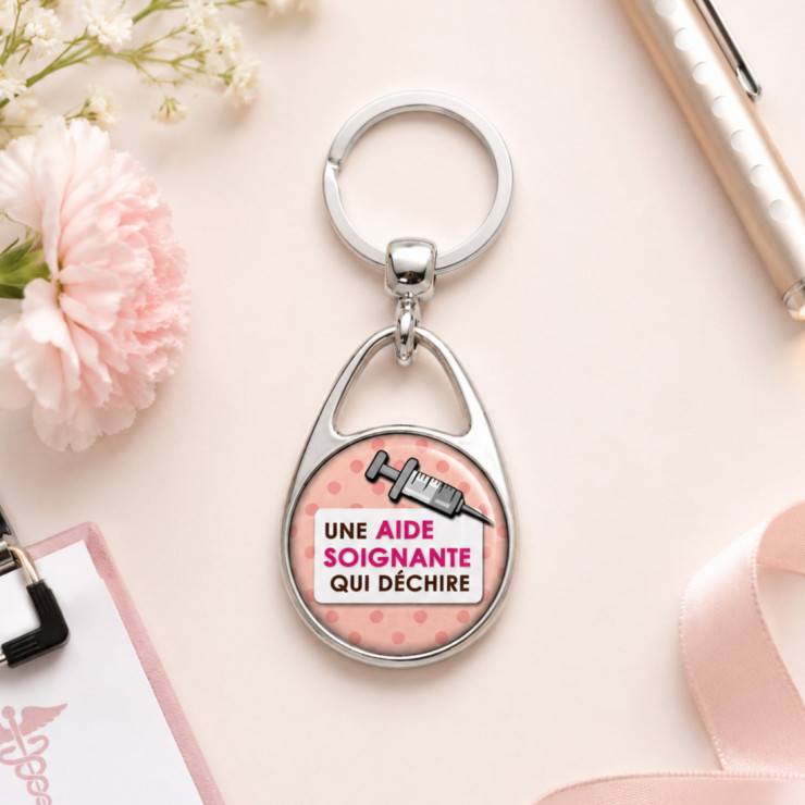       Beau porte clés "Une aide soignante qui déchire"
    