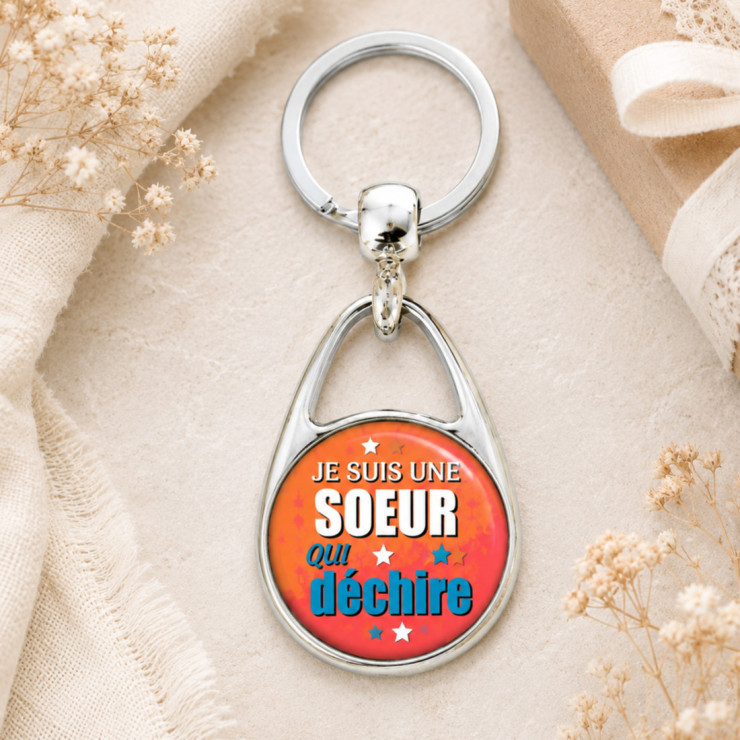                     Porte clés "Je suis une soeur qui déchire!" orange
                  