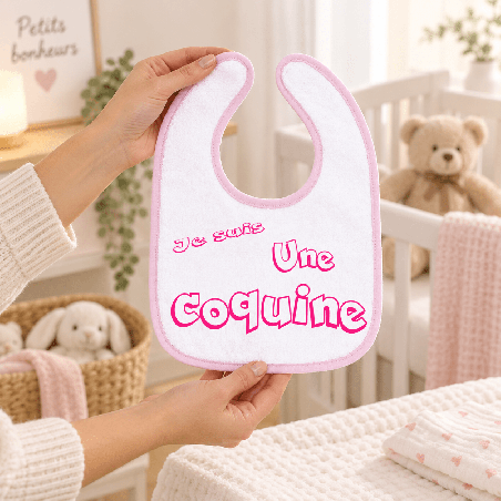       Bavoir personnalisable rose pour accompagner les repas de bébé
    